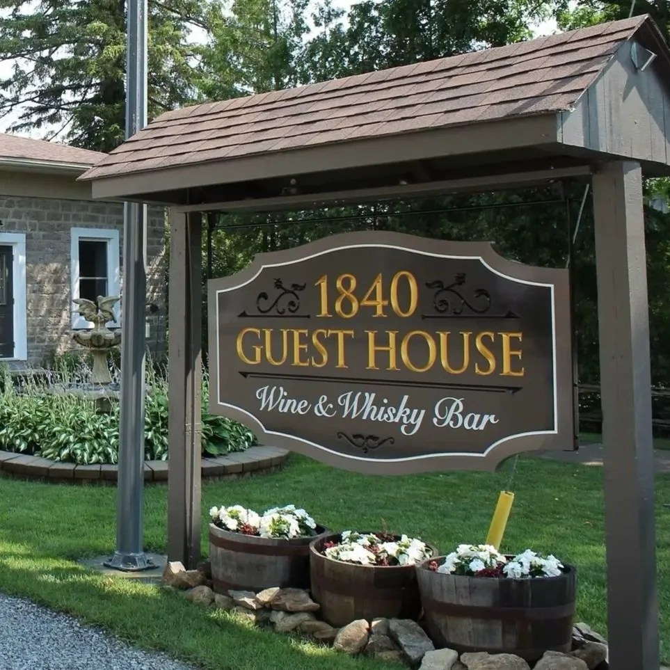 1840 Guest House Wine & Whisky Bar sign