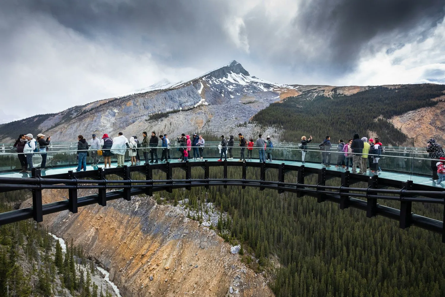 Tour group on a mountain viewpoint bridge